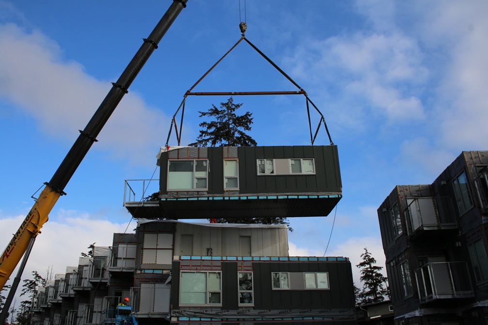 Modular units being craned into position