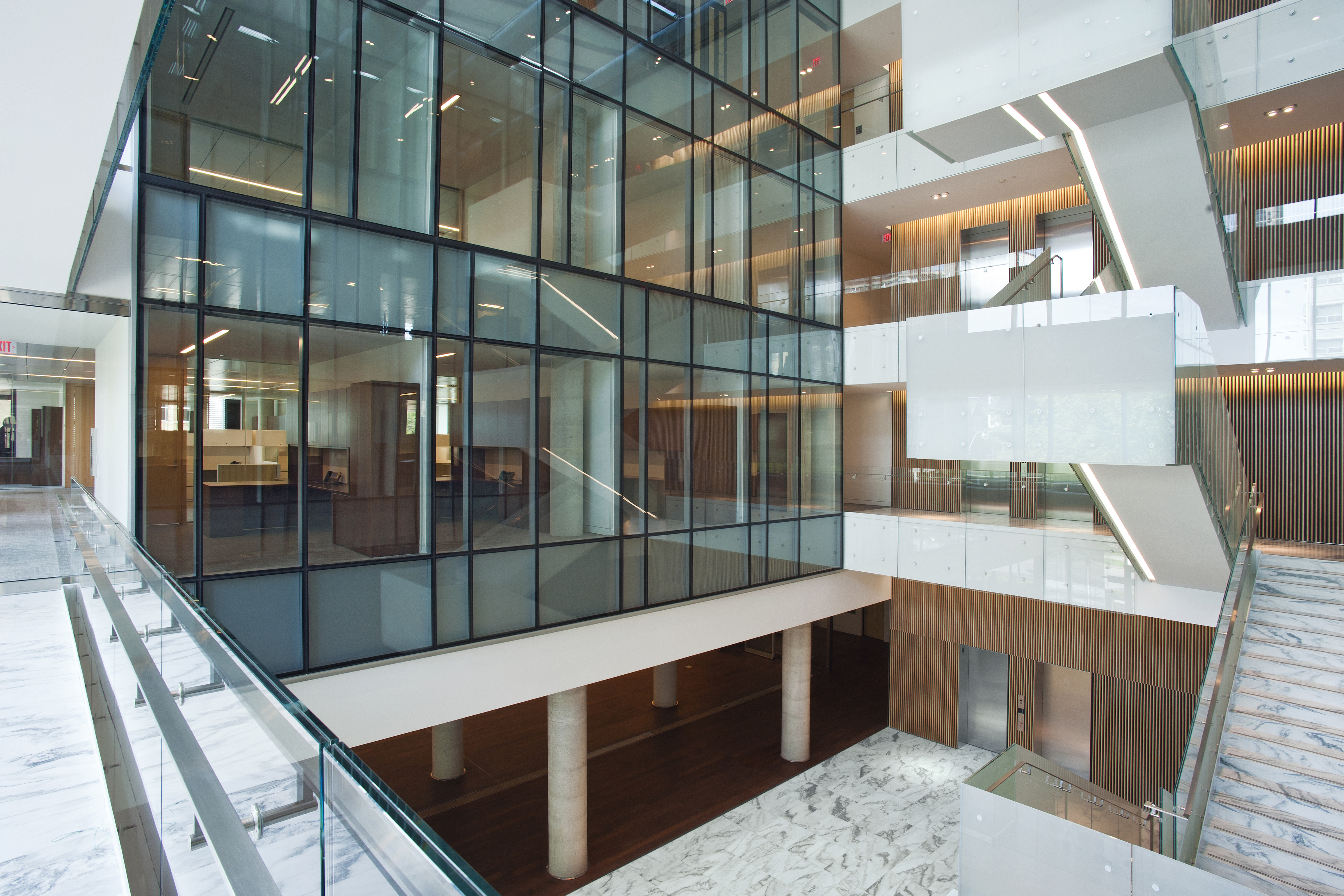 Interior view of the lobby of the ETFO building showing interior glass facade and stairs 