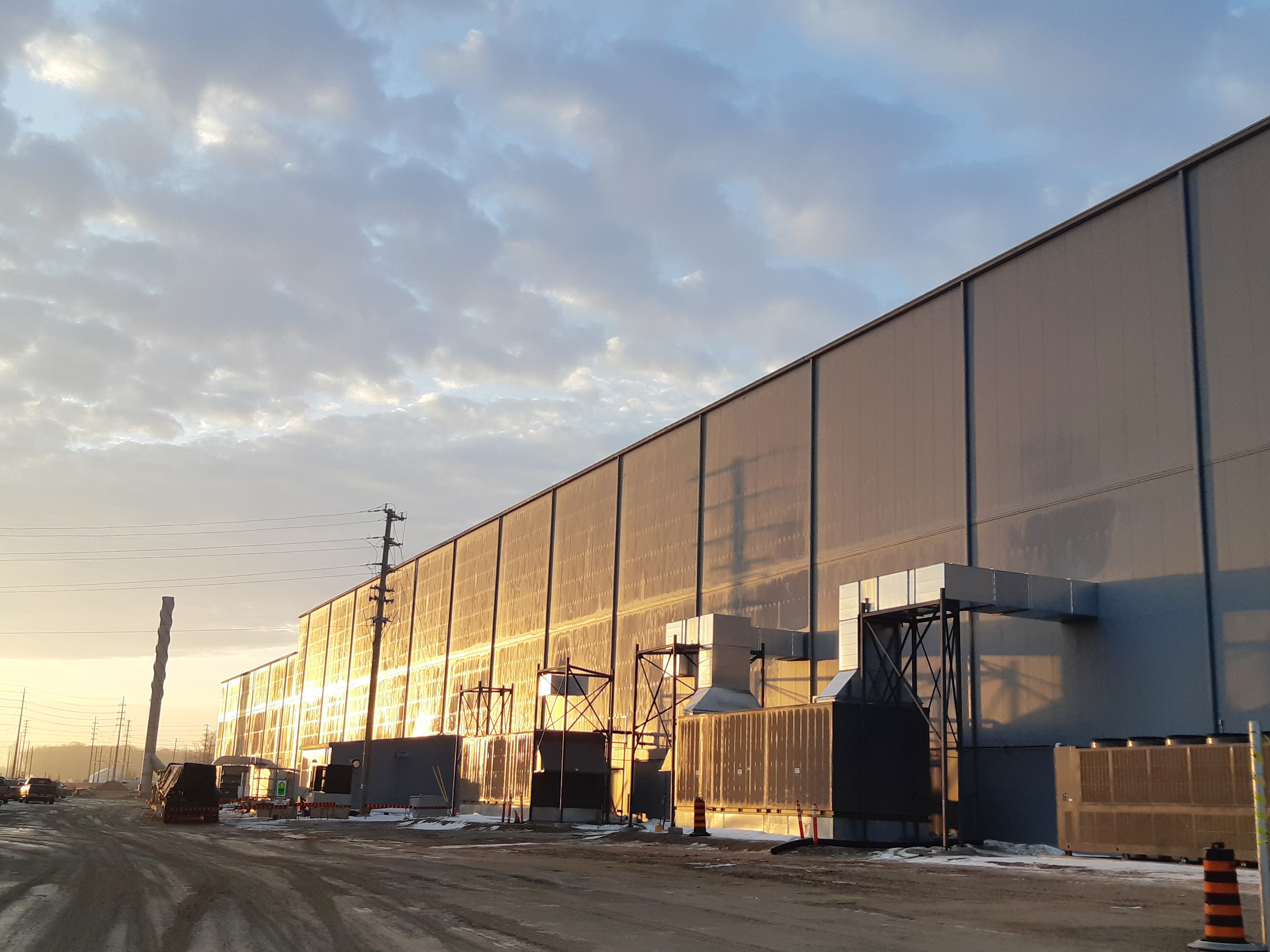 Exterior shot of a warehouse at sunset