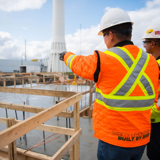worker pointing to construction underway