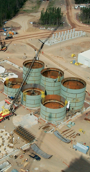 Aerial Image of Mobile Crane and Six Partially Erected Storage Tanks