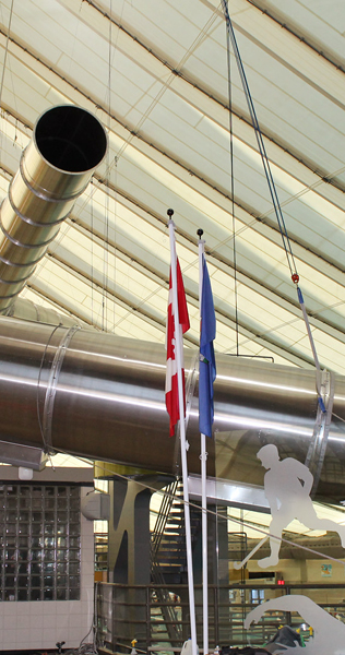 Interior details of the Talisman Recreation Centre project including flagpoles and frosted glass panels