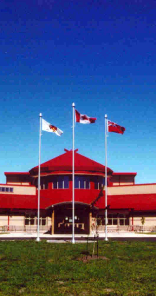 Front Entrance Porte-Cochere with Brick Envelope and Red Roofing