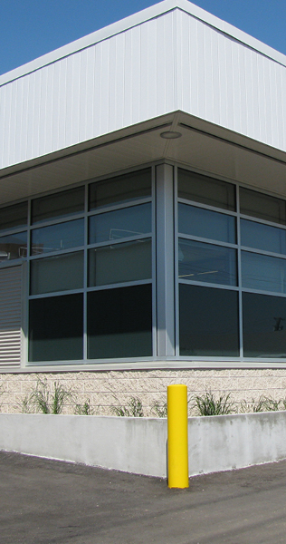 Corner Building Detail of Masonry, Glazing and Steel Panel