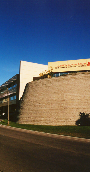 Curvilinear Masonry Retaining Wall Below Signed Entrance