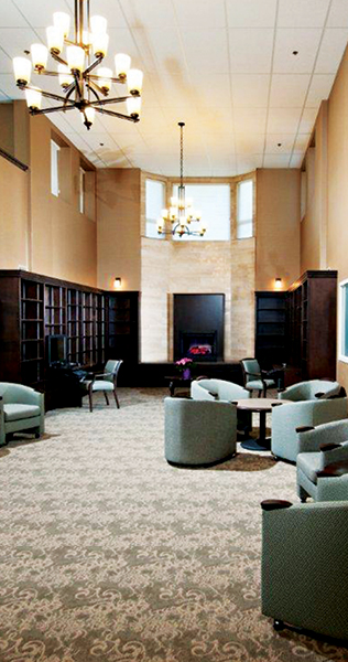 High Ceilinged Lounge Area with Seating and Chandeliers 