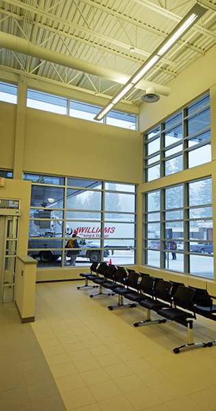 Seating Area with Glazing, Exposed Ductwork and Open Web Steel Ceiling Joists