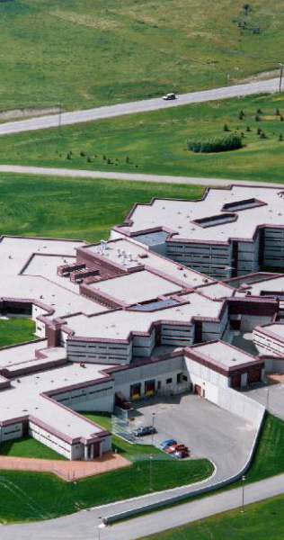 Ariel View of the Multifaceted Building Against Green Landscaped Lawns