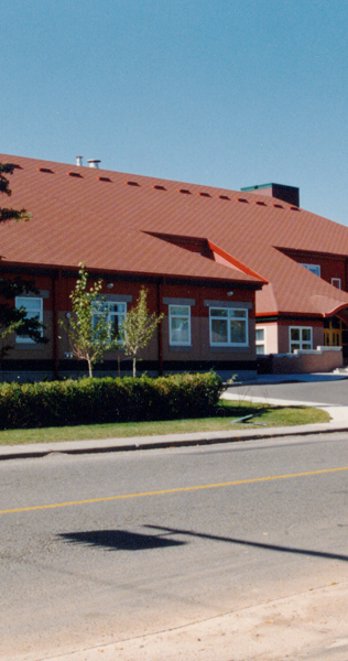 Street View of Brick and Glazed Facade with Gabled Roof