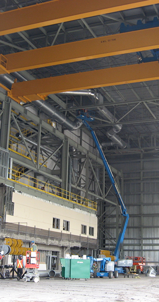 High Ceilinged Shop with Overhead Cranes and Manlift