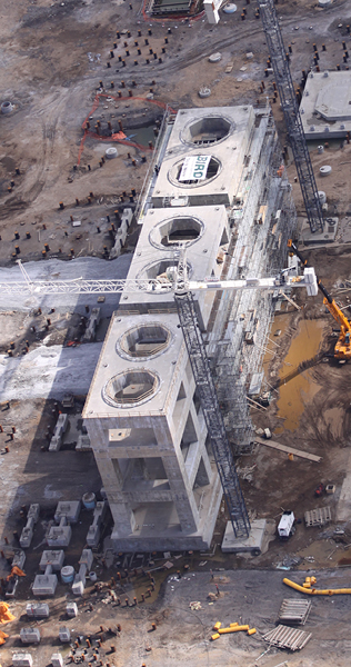 Aerial View of Construction Progress with Two Tower Cranes