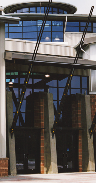 Concrete Buttresses with Brick and Glazed Envelope