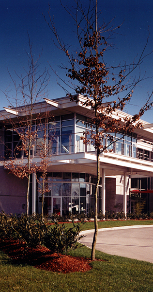 Foreground Landscaping with Brick and Glazed Building in Background