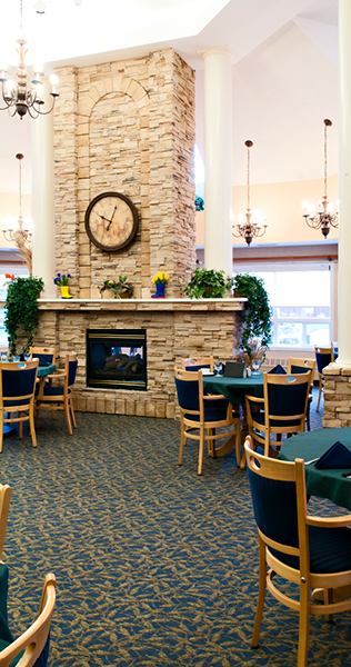 Dining Tables Surround a Stone Fireplace 