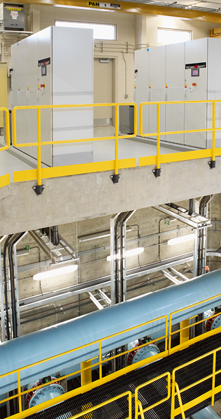 Atrium with Pipe Gallery on Bottom Floor and Electrical Panels on Top Floor