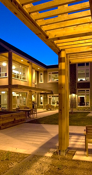 Exterior Courtyard With Pergola Against an Evening Sky