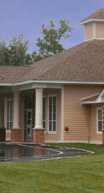 Front Entrance With Siding Detail and Columns