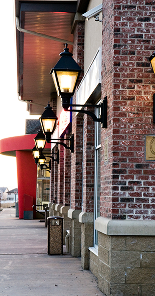 Exterior Sconce Lights Fixed to the Brick Facade