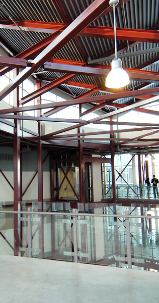 Atrium With Glass Railing and Exposed Structural Steel Ceiling