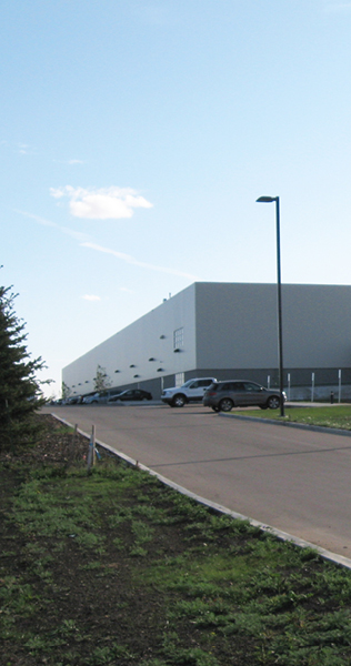 Driveway Leading to Warehouse Building in the Distance