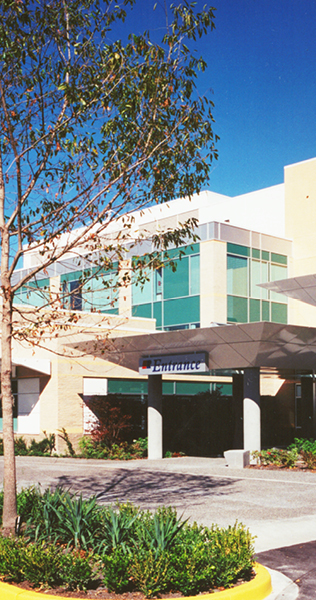 Canopied Entrance with Landscaping and Entrance Sign