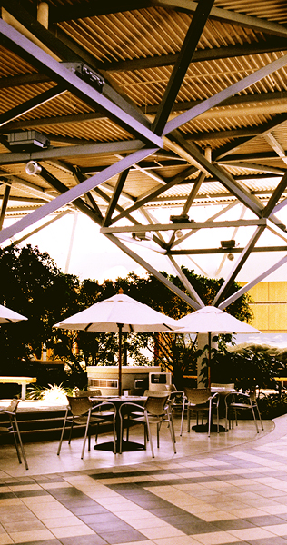 Tables and Chairs Under an Exposed Structural Steel Canopy