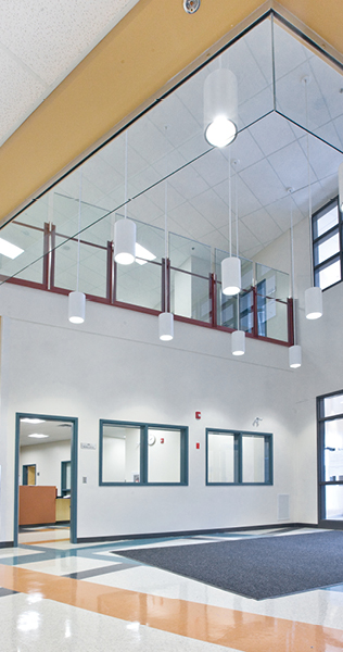 Entrance lobby of school showing hanging lights 