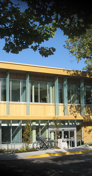 Exterior of Childrens and Womens Health Centre Clinical Support Building showing front entrance and bike rack