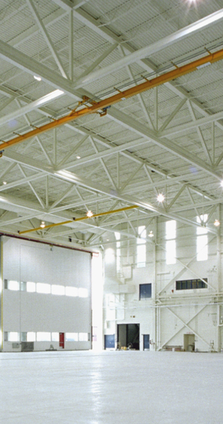 Interior of the Fixed Wing Hangar Addition 19 Wing showing roof and entrance bay door