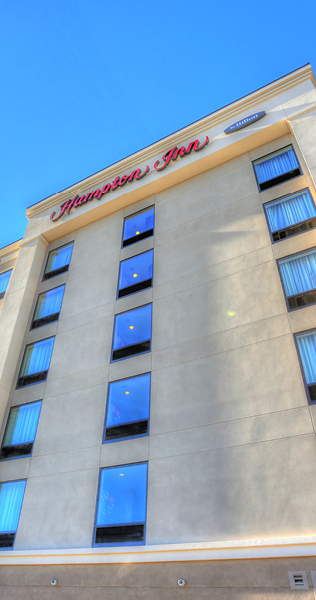 Exterior view of Hampton Inn looking up the front of the building from ground level