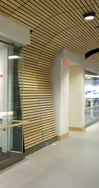 Interior detail of SFU Surrey campus walkway showing wood cladding