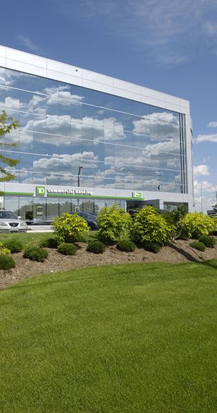 Exterior of Milestone Corporate Centre showing sky reflected in the window facade