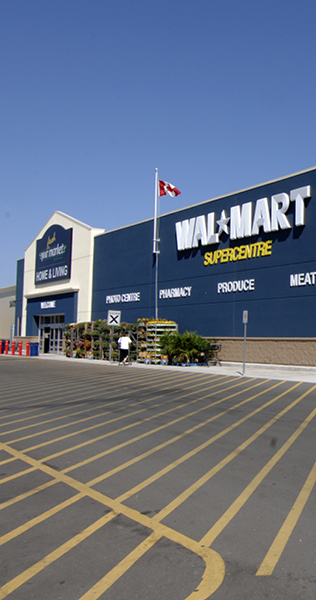 Exterior of WalMart Wasaga showing front entrance and flag