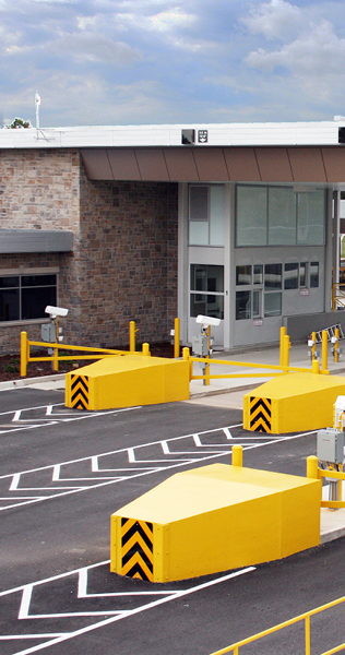 Border crossing lanes and part of the border crossing building showing a service window