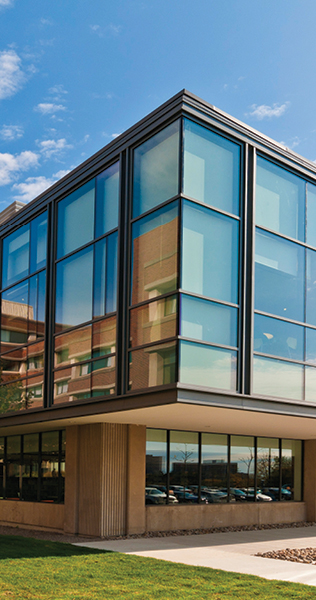 Exterior view of a corner of  Osgoode Hall at York University showing windows of varying sizes creating the building facade