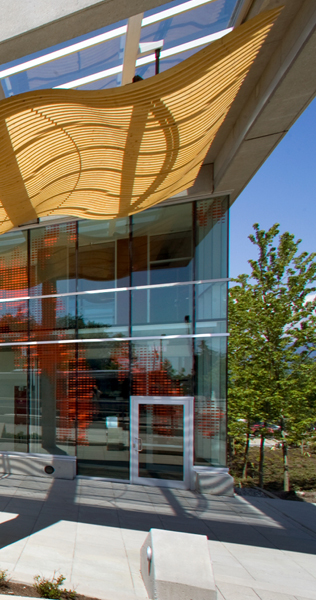 Exterior details of Simon Fraser University Saywell Hall and Blusson Hall showing unique roof features and glass facade