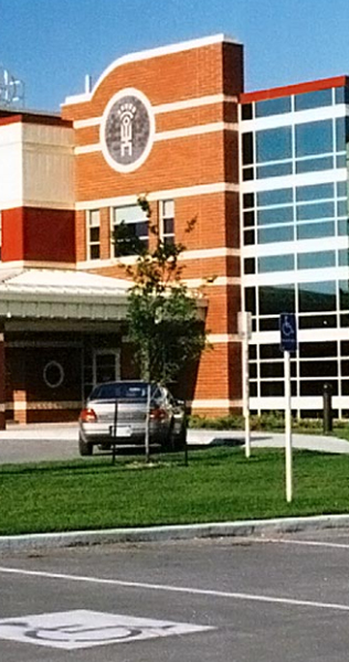 Exterior of the Boundary Trails Hospital showing entrance, brick cladding and glass facade