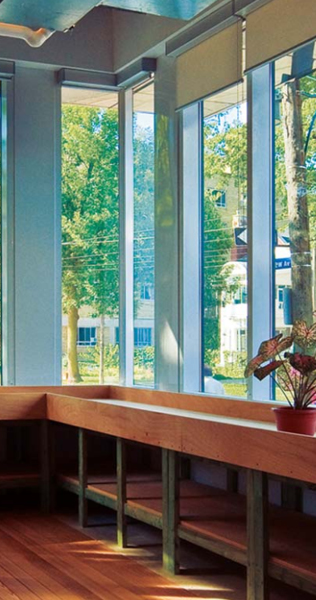 Interior detail of Broadview condo showing large windows and wood finishes