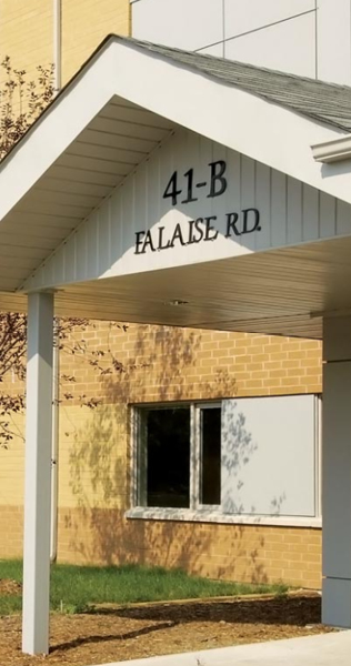 Entrance of the CFB trainer building showing covered walkway and building signage