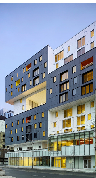 Exterior corner of 60 Richmond Street housing showing blue and white facade