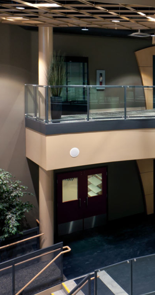 Interior of building lobby showing mezzanine and walkways