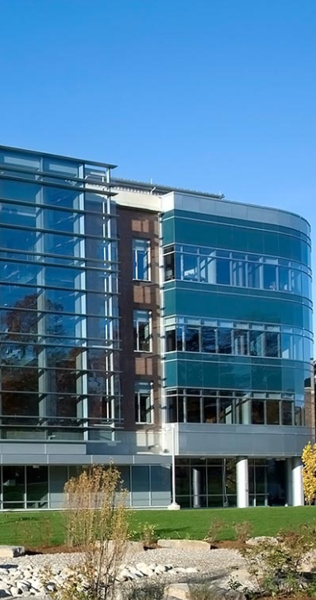Exterior of the Ontario Veterinary College showing blue-tinted glass facade