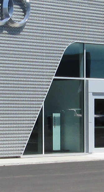 Glass and Textured Steel Panel Facade with Building Entrance