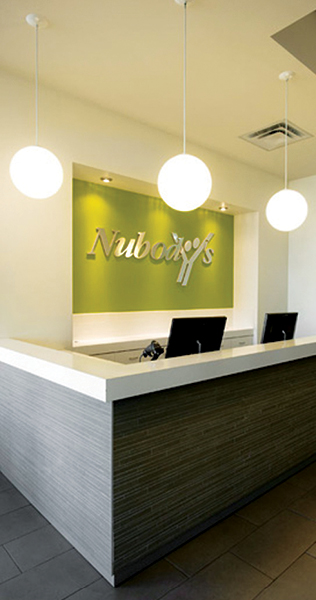 Reception Desk with Nubody's Sign and Feature Lighting