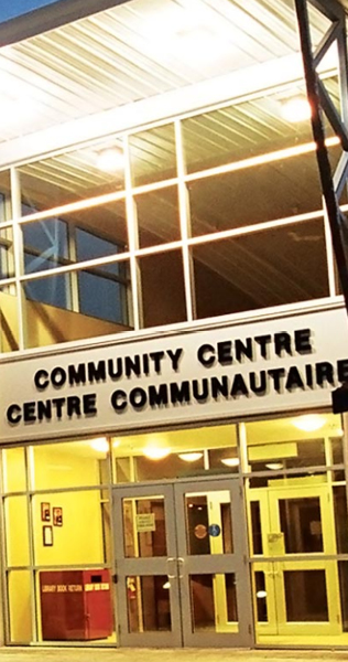 Lit up front entrance of the Shilo Community Centre