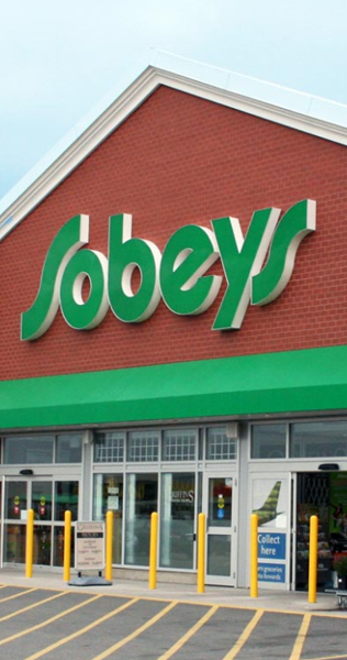 Exterior entrance of Sobeys with building signage