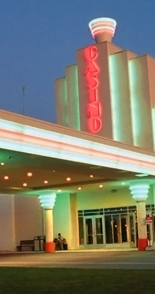 Neon-lit front entrance and portico of the South Beach Casino