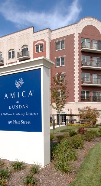 Amica Facade with Balconies and Brick including Amica Street Sign