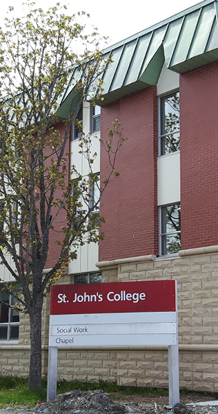 Masonry and Brick Envelope with Punch Windows, Steel Roof and Signage