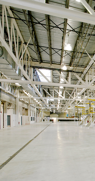 Large Open Space with Concrete Floor and Open Web Steel Ceiling Joists